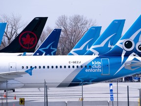 Air Transat and an Air Canada aircrafts are seen on the tarmac at Montreal-Trudeau International Airport in Montreal, on Wednesday, April 8, 2020.