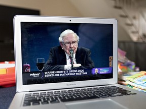 Warren Buffet, chairman and chief executive officer of Berkshire Hathaway Inc., speaks during the virtual Berkshire Hathaway annual shareholders meeting seen on a laptop computer in Arlington, Virginia, U.S., on Saturday, May 2, 2020.