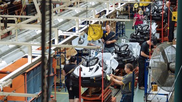 Workers at the manufacturing line for the BRP Tundra snowmobile at the BRP assembly plant in Valcourt, Quebec on Tuesday, July 4, 2017.