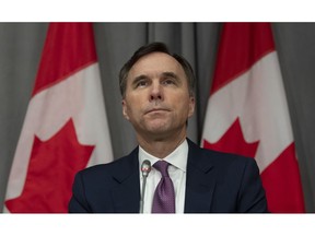 Minister of Finance Bill Morneau listens to a question during a news conference Friday May 1, 2020 in Ottawa. The federal government says it will provide loans and financing to the countries largest employers to help them weather the COVID-19 economic crisis.