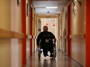 A resident on a wheelchair is seen at the La Weiss retirement home (EHPAD - Housing Establishment for Dependant Elderly People) in Kaysersberg, as the spread of the coronavirus disease (COVID-19) continues in France.