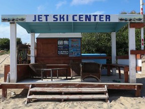 A closed jet ski rental shop is seen along a beach in the resort town of Ayia Napa on the southeast coast of Cyprus. The island is gradually eases lockdown restrictions placed for the COVID-19 coronavirus pandemic.