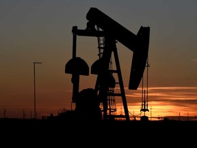 A pump jack operates at sunset in an oil field in Midland, Texas U.S. The number of operating oil and gas rigs in the world's largest oil producer fell to 374 in the week to May 8, a record low according to data going back to 1940 from energy services company Baker Hughes Co.