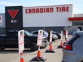 Signs for customer pickup at a Canadian Tire in Sudbury, Ont.