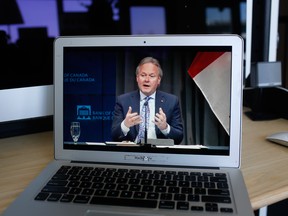 Stephen Poloz, outgoing governor of the Bank of Canada, speaks during a virtual news conference seen on a laptop computer.