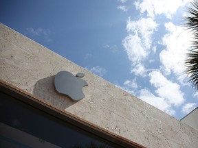 An Apple sign outside a store in Florida.