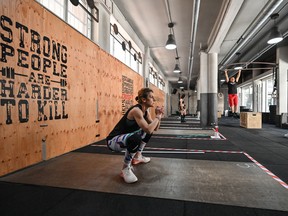 Customers exercise at a CrossFit gym in Rome, Italy.