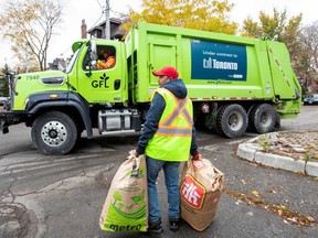 A truck from Canadian waste management company GFL Environmental Inc makes its rounds through a neighbourhood in Toronto.
