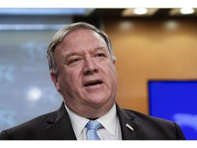 In this June 11, 2020, file photo, Secretary of State Mike Pompeo speaks at the State Department in Washington. Pompeo is calling on China to release two Canadian men that he says face "groundless" charges of spying.