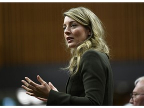 Minister of Economic Development Melanie Joly rises during Question Period in the House of Commons on Parliament Hill in Ottawa on Friday, Jan. 31, 2020. The federal minister in charge of regional economic development says more needs to be done to help companies in the centre of Canada's biggest cities so they can stay open through and beyond the COVID-19 pandemic.