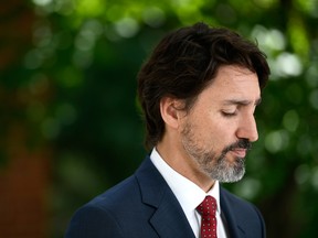Prime Minister Justin Trudeau speaks during a news conference on the COVID-19 pandemic outside his residence at Rideau Cottage in Ottawa, on Thursday.