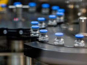 Vials of investigational coronavirus disease (COVID-19) treatment drug remdesivir are capped at a Gilead Sciences facility in La Verne, California.