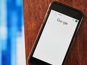 The Google Inc. search page is displayed on a smartphone.