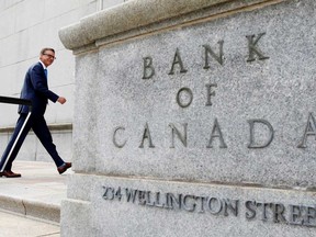 Governor of the Bank of Canada Tiff Macklem walks outside the Bank of Canada building in Ottawa.