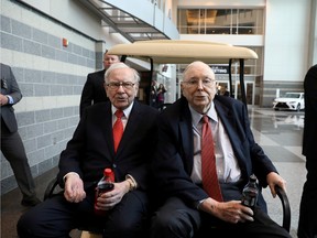 Berkshire Hathaway Chairman Warren Buffett (left) and Vice Chairman Charlie Munger are seen at the annual Berkshire shareholder shopping day in Omaha, Nebraska, U.S., May 3, 2019.