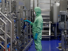 A technician works at a manufacturing facility of Chinese vaccine maker CanSino Biologics in Tianjin, China November 20, 2018.