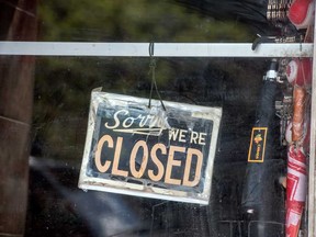 A closed sign on a Toronto store’s front door during the Covid 19 pandemic.