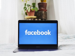 Facebook signage displayed on a laptop computer.