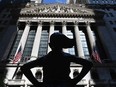 The "Fearless Girl" statue stands in front of the New York Stock Exchange (NYSE) at Wall Street in New York City.