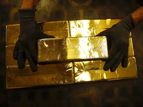 Gold slid Tuesday after a record-breaking rally.