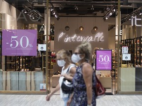 Shoppers wear masks inside a mall in Montreal.