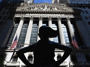 The "Fearless Girl" statue stands in front of the New York Stock Exchange.