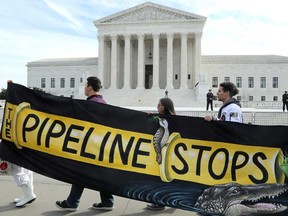 Climate activists protest the Atlantic Coast Pipeline in front of the U.S. Supreme Court in February.