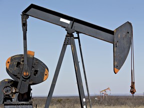 Pumpjacks operate on oil wells in the Permian Basin near Crane, Texas.