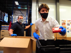 Prime Minister Justin Trudeau volunteers at the Moisson Outaouais food bank in Gatineau, Quebec, on July 3, 2020.