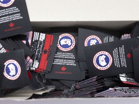Made In Canada" tags sit in a box at the new Canada Goose Inc. manufacturing facility in Montreal, Quebec, Canada, on Monday, April 29, 2019.