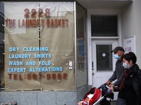 A closed dry cleaning shop in the U.S. Even dry cleaners have suffered as people no longer need to look their best at the office.