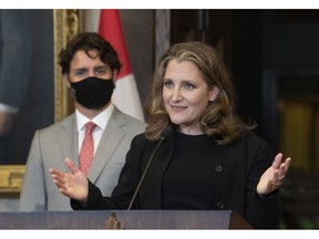 Prime Minister Justin Trudeau looks on as Deputy Prime Minister and Finance Minister Chrystia Freeland responds to a question during a news conference on Parliament Hill in Ottawa, Tuesday, Aug. 18, 2020.