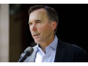 Canada's official fiscal watchdog says the federal wage subsidy program may cost more than $14 billion less than what the government estimated. Canada's Minister of Finance Bill Morneau speaks to media during a press conference in Toronto, Friday, July 17, 2020.