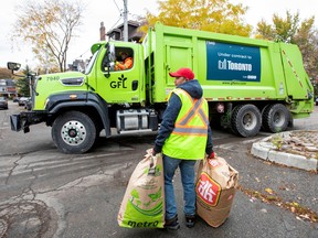 A truck from Canadian waste management company GFL Environmental Inc. makes its rounds through a neighbourhood in Toronto in 2019.