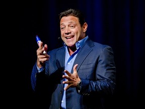 ormer Wall Steet player turned novelist Jordan Belfort, author of The Wolf of Wall Street which was adapted into a film by Martin Scorsese in 2013, gestures during a performance in the Rai, in Amsterdam, on November 20, 2014.