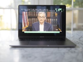Jerome Powell, chairman of the U.S. Federal Reserve, speaks during the Jackson Hole economic symposium seen on a laptop computer.