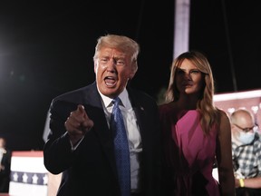 U.S. President Donald Trump and U.S. First Lady Melania Trump greet attendees after a speech by U.S. Vice President Mike Pence during the Republican National Convention on Aug. 26, 2020.