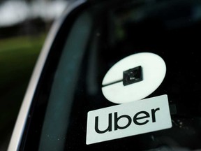 An Uber logo is shown on a rideshare vehicle during a statewide day of action to demand that ride-hailing companies Uber and Lyft follow California law and grant drivers "basic employee rights,” in Los Angeles, California.