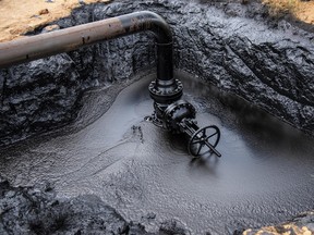 A pipe leaks oil in Venezuela, in 2018.