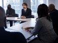 Prime Minister Justin Trudeau sits alongside HXOUSE incubator co-founder Ahmed Ismail, as he meets with Black entrepreneurs at HXOUSE in Toronto on Sept. 9.