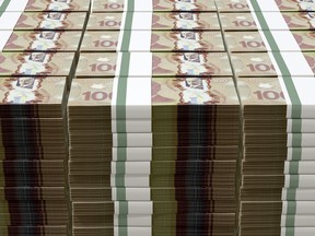 stack of cash with $100 CAD bills