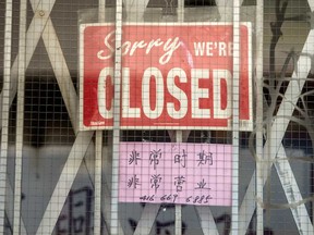 A closed sign on a Toronto store front in May. While the economy may not look exactly the same post-pandemic, history has shown that it will ultimately recover, writes Martin Pelletier.