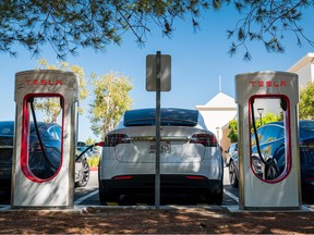 A Tesla Inc. vehicle charges at a charging station in San Mateo, California, U.S., on Tuesday, Sept. 22, 2020.