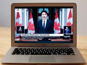 Justin Trudeau, Canada's prime minister, speaks during a national  address as seen on a laptop computer in Ottawa, Ontario, Canada, on Wednesday.