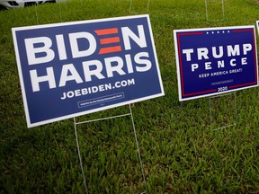 Campaign signs are seen at Westchester Regional Library in Miami, Florida on October 19, 2020.