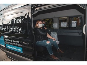 A registered nurse gives copywriter Ammie Matte the flu shot in Klick Health's Mobile Flu Shot Clinic outside her Toronto home on October 28, 2020. Matte is one of hundreds of Klick employees who signed up for the unique program as the company continues to adapt its people-first programs during the pandemic.
