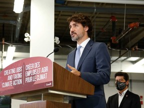 Prime Minister Justin Trudeau speaks during a news conference at the Ford Connectivity and Innovation Centre in Ottawa on Oct. 8, 2020, when it was announced that the Ontario and federal governments would give Ford $590 million to retool its Oakville plant for electric vehicle manufacturing.