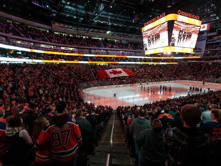  Hockey fans sing Oh Canada before the Edmonton Oilers play the Minnesota Wild during a NHL hockey game at Rogers Place in Edmonton, on Friday, Feb. 21, 2020.