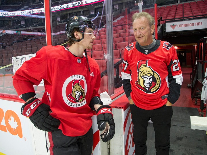  Ottawa Senators owner Eugene Melnyk chats with defenceman Thomas Chabot at the 16th annual Eugene Melnyk Skate for Kids at Canadian Tire Centre on Dec. 20, 2019.