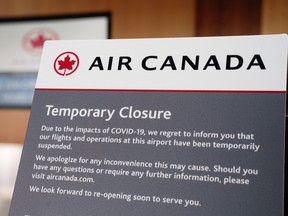 A "Temporary Closure" sign is displayed on an Air Canada ticketing counter in Terminal 2 at San Diego International Airport (SAN) in San Diego, California, U.S., on Monday, April 27, 2020.